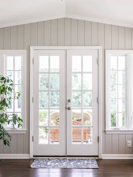Large and open living room den sun room with windows on two side Large and open living room den sun room with windows on two side